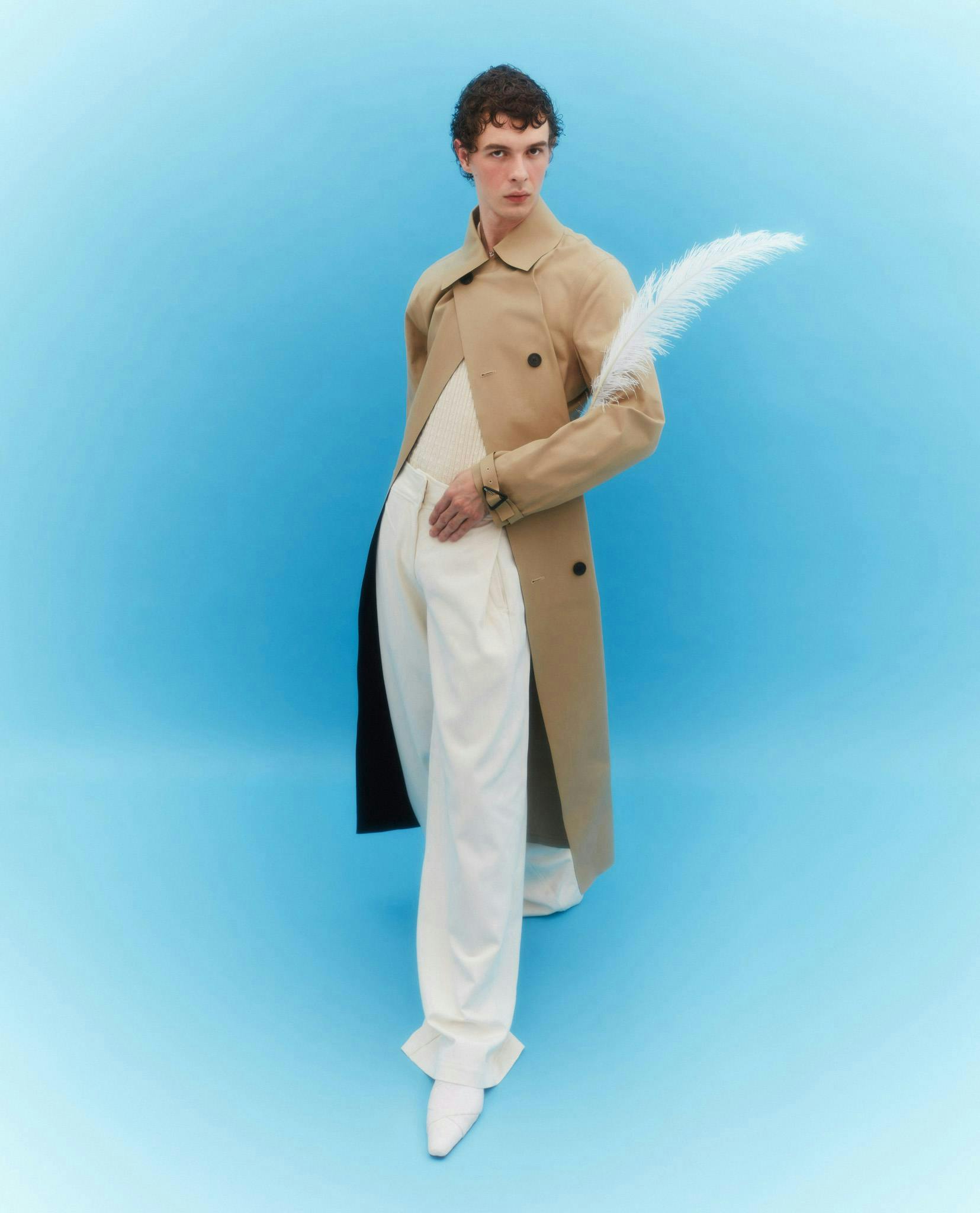 clothing apparel sleeve overcoat coat person human
