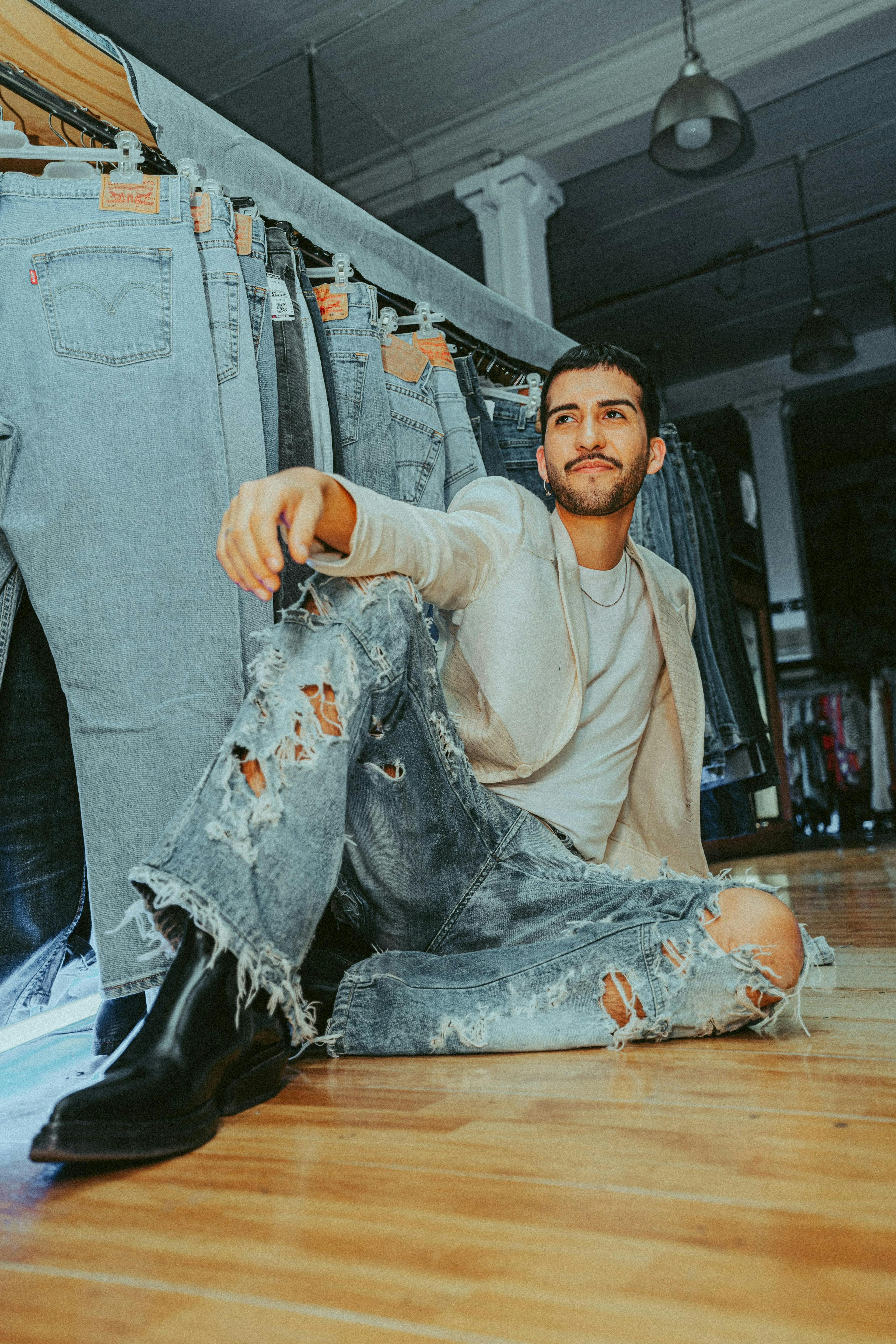 pants jeans wood hardwood floor flooring adult male man person