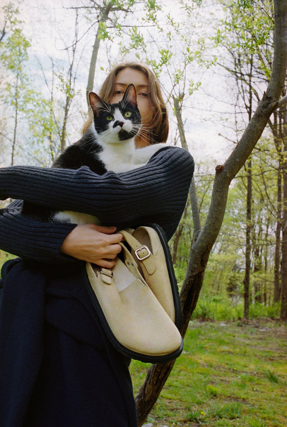 bag handbag adult female person woman knitwear sweater tree cat