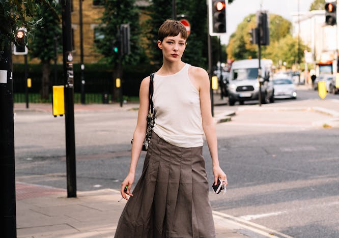 clothing skirt light traffic light person accessories bag handbag